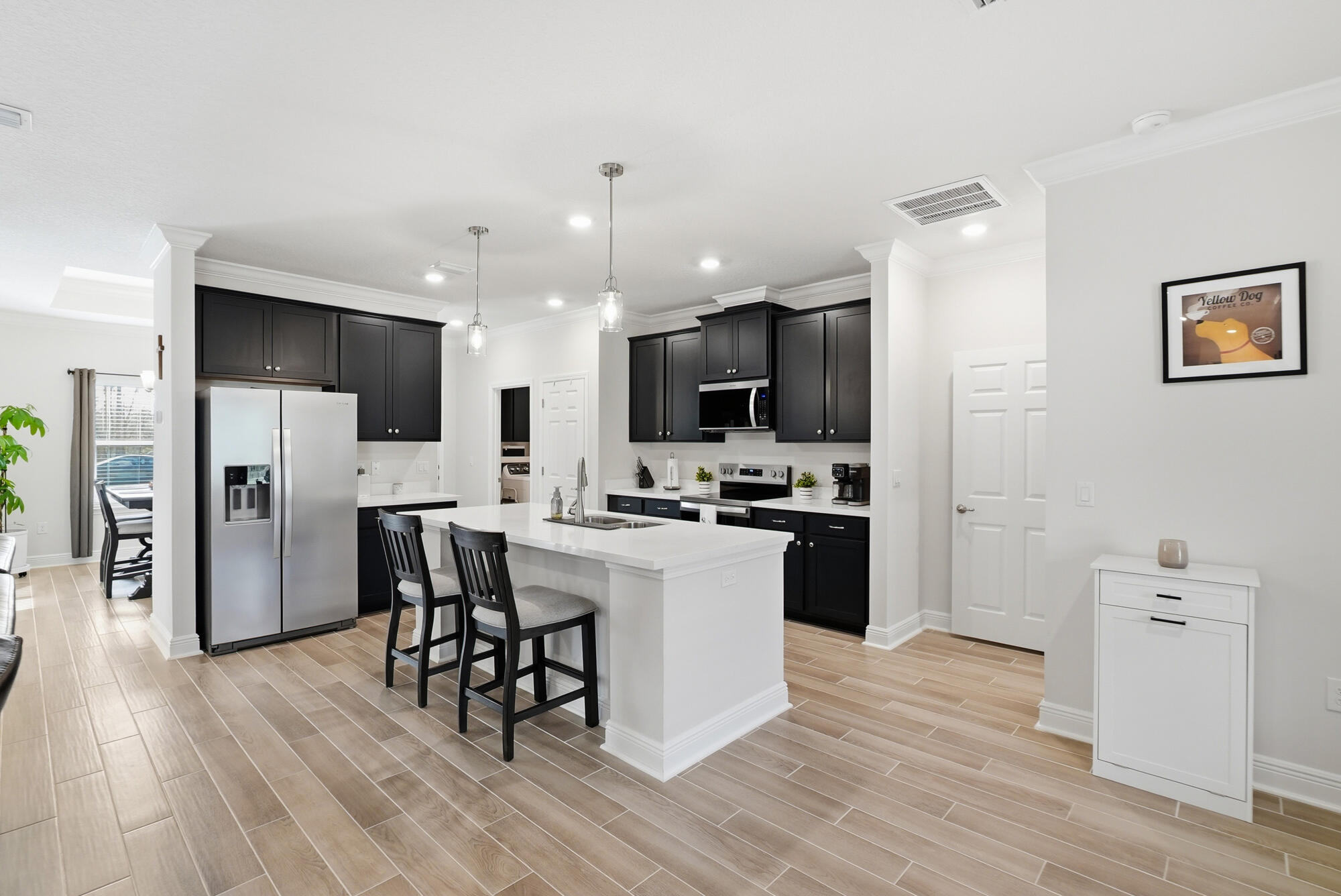 158 Bentgrass Road South Freeport, FL 32439 - Photo 11 of 66 a kitchen with a sink a counter top space stainless steel appliances and cabinets