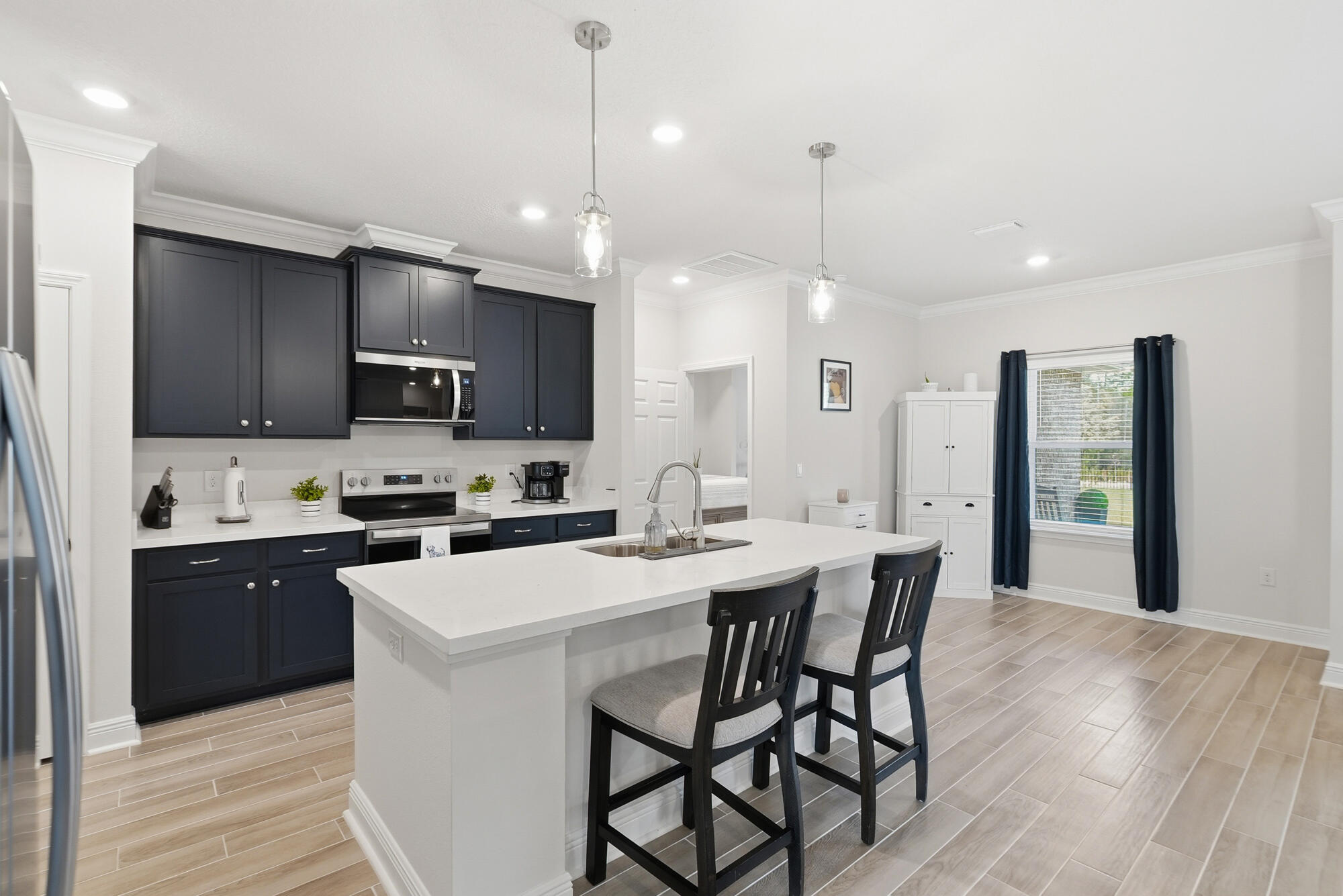 158 Bentgrass Road South Freeport, FL 32439 - Photo 12 of 66 a kitchen with microwave a sink stove and refrigerator