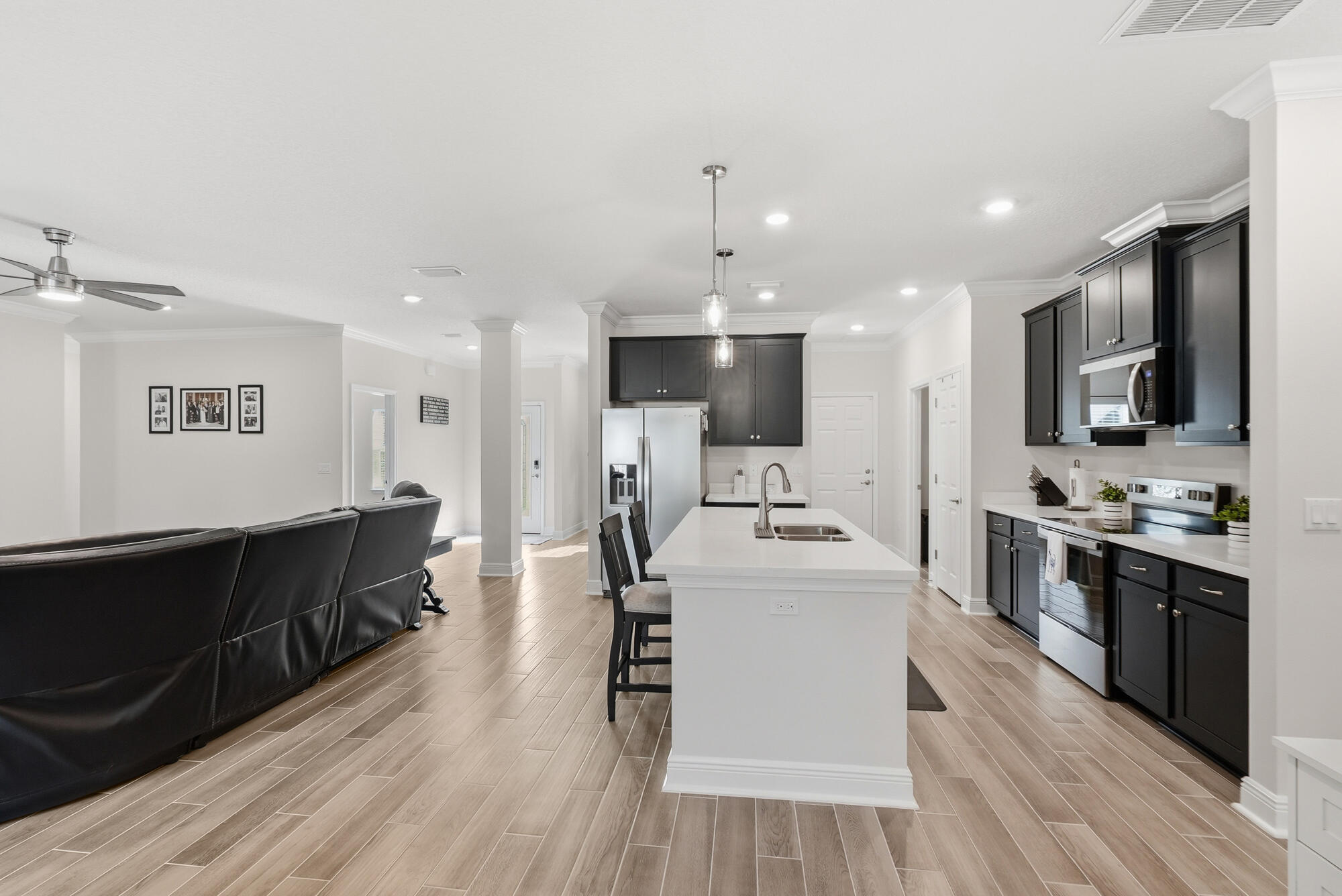 158 Bentgrass Road South Freeport, FL 32439 - Photo 14 of 66 a large kitchen with stainless steel appliances kitchen island a large counter top and a stove top oven