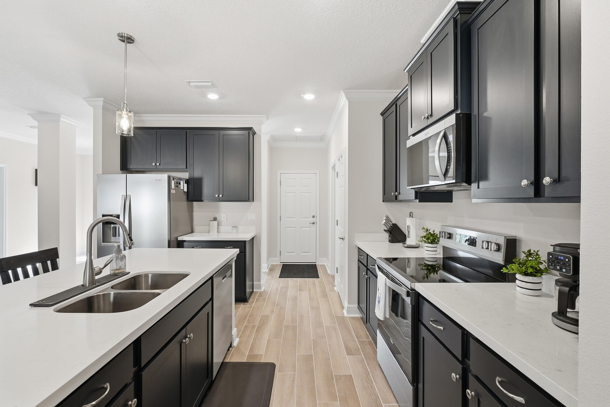 158 Bentgrass Road South Freeport, FL 32439 - Photo 15 of 66 a kitchen with a sink stove and refrigerator