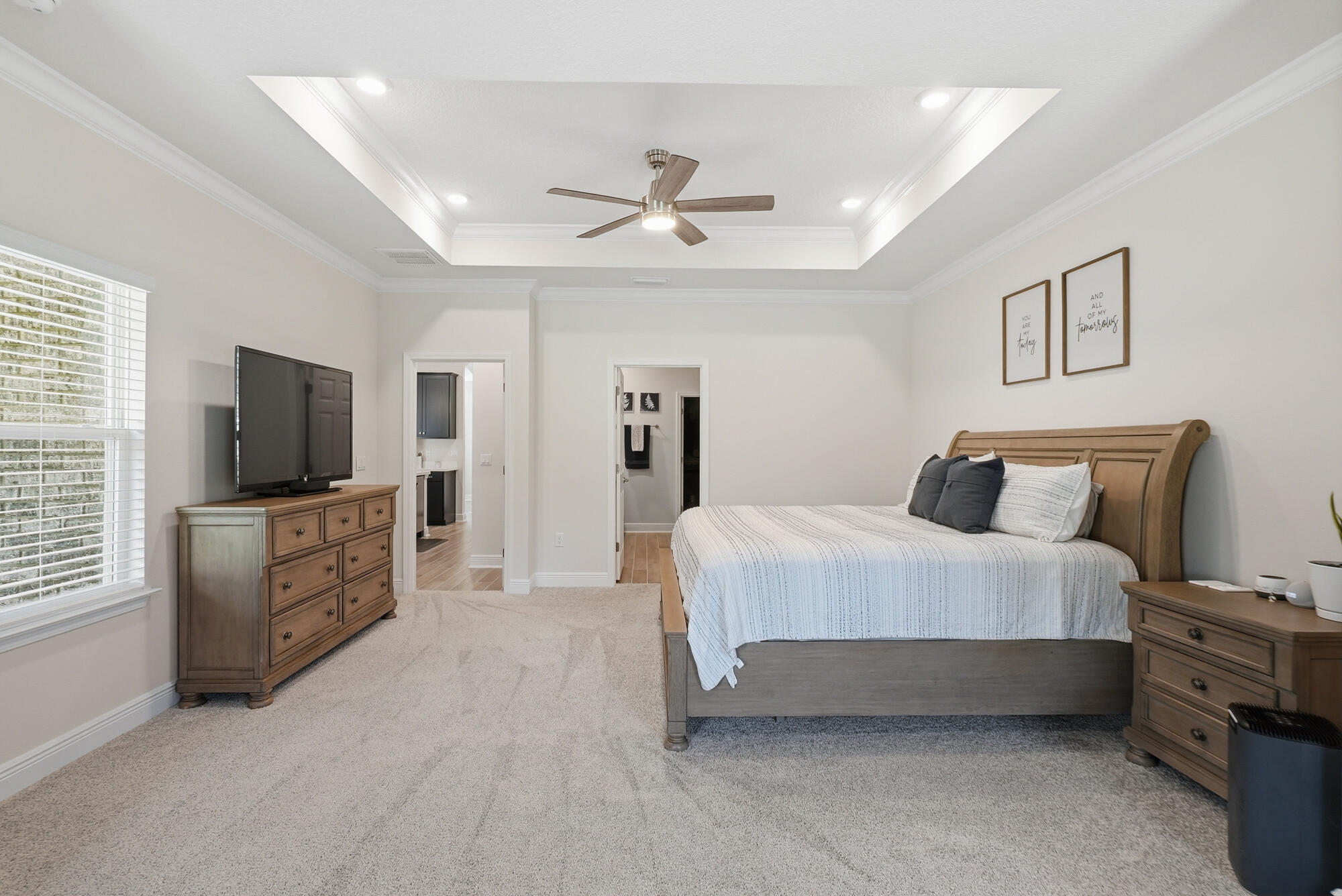 158 Bentgrass Road South Freeport, FL 32439 - Photo 20 of 66 a spacious bedroom with a bed and a flat screen tv