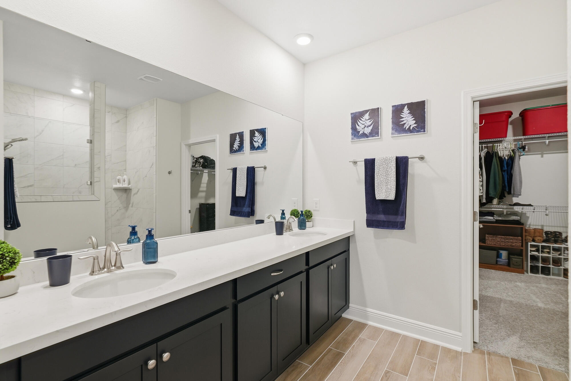 158 Bentgrass Road South Freeport, FL 32439 - Photo 22 of 66 a spacious bathroom with a double vanity sink and a large mirror