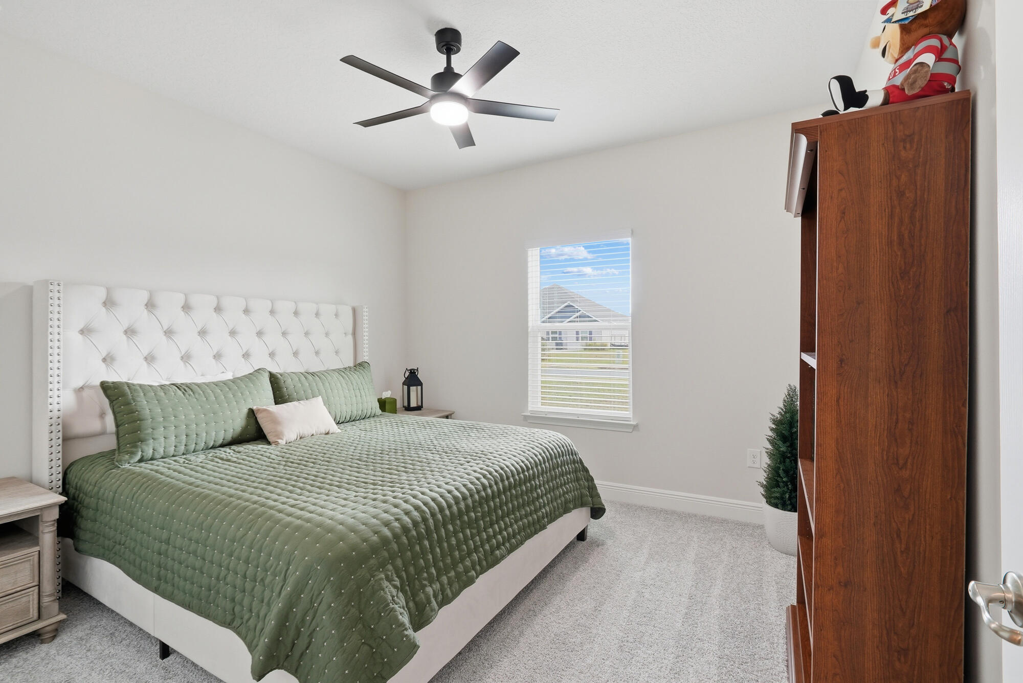 158 Bentgrass Road South Freeport, FL 32439 - Photo 25 of 66 a bedroom with a large bed and a window