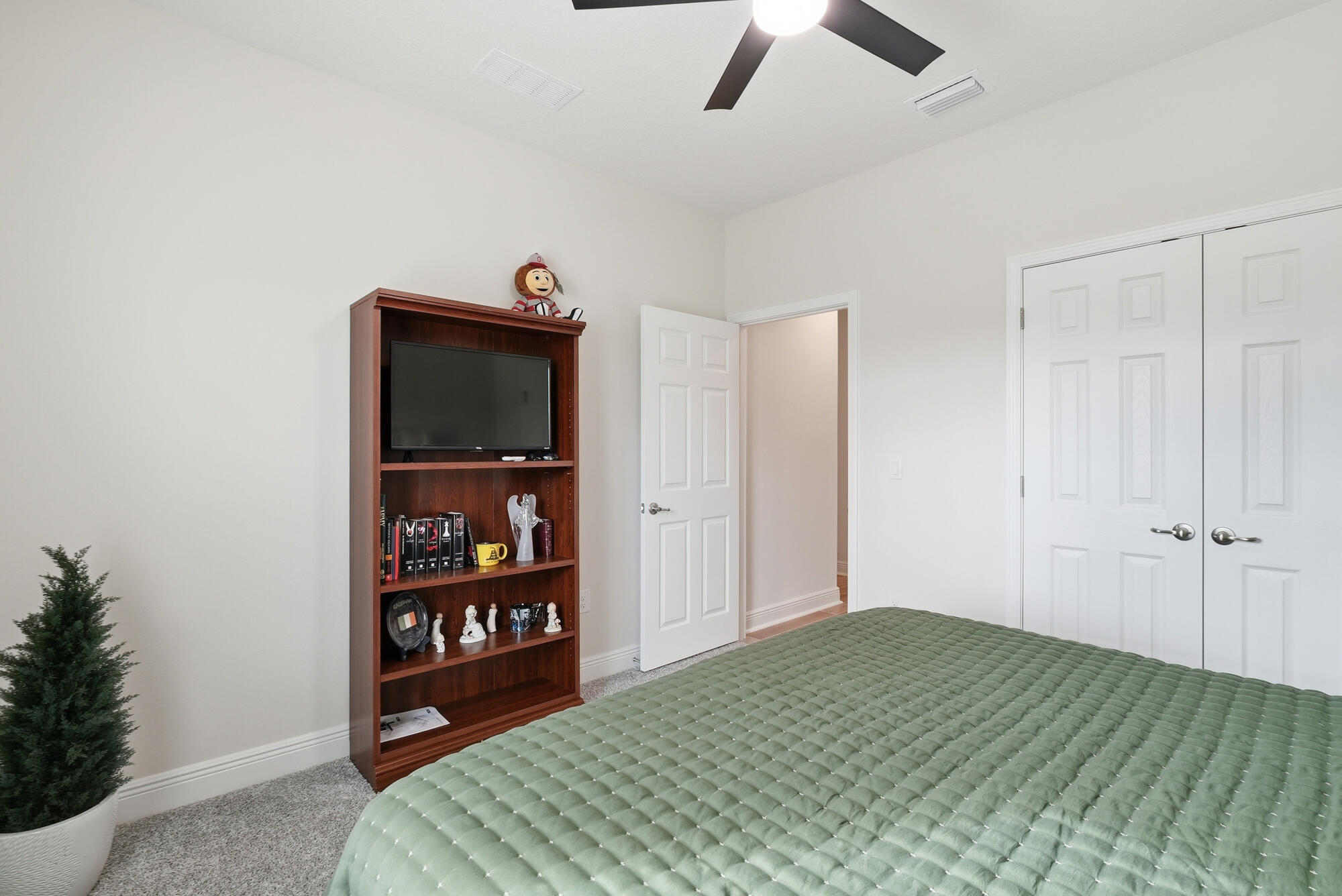 158 Bentgrass Road South Freeport, FL 32439 - Photo 26 of 66 a bedroom with a bed and a book shelf