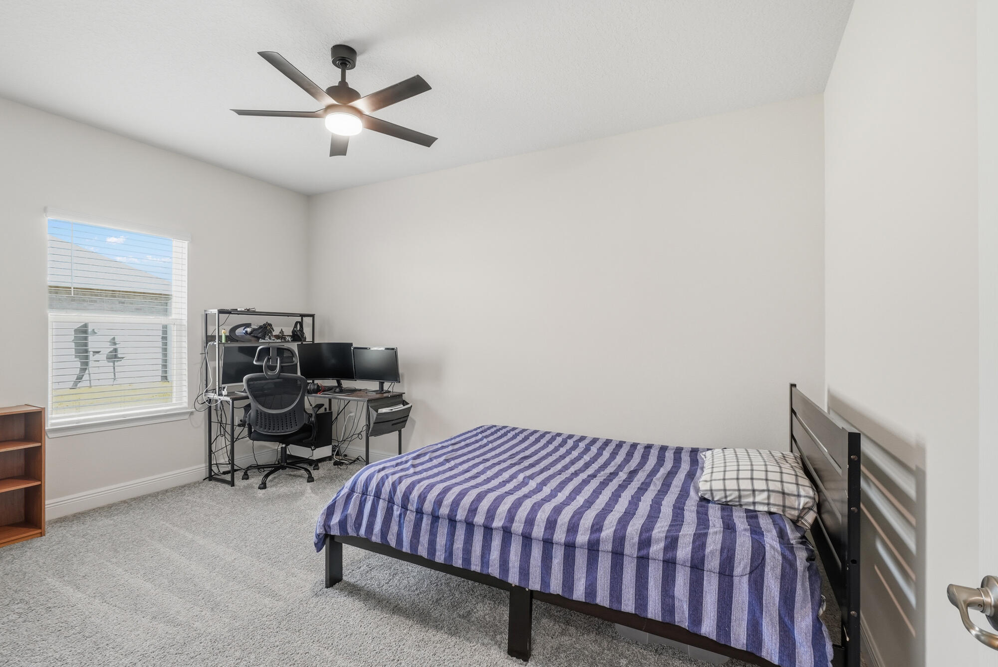 158 Bentgrass Road South Freeport, FL 32439 - Photo 27 of 66 a bedroom with bed and a chandelier