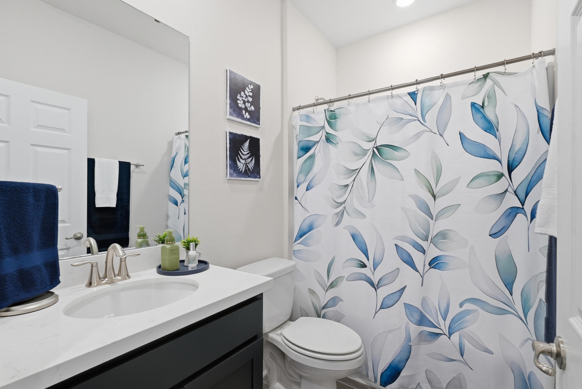 158 Bentgrass Road South Freeport, FL 32439 - Photo 31 of 66 a bathroom with a granite countertop sink and a mirror