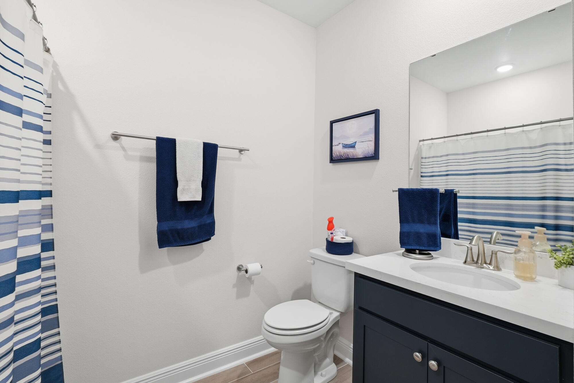 158 Bentgrass Road South Freeport, FL 32439 - Photo 32 of 66 a bathroom with a toilet sink and mirror