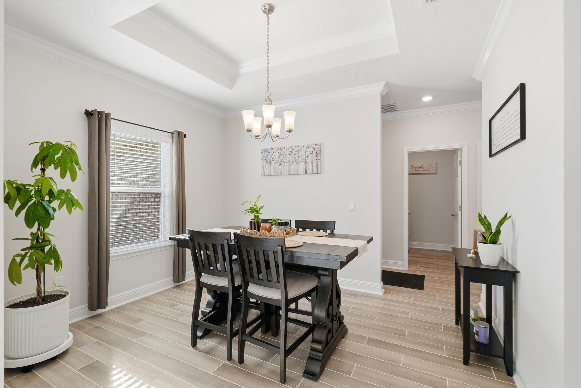 158 Bentgrass Road South Freeport, FL 32439 - Photo 4 of 66 a view of a dining room with furniture window and wooden floor
