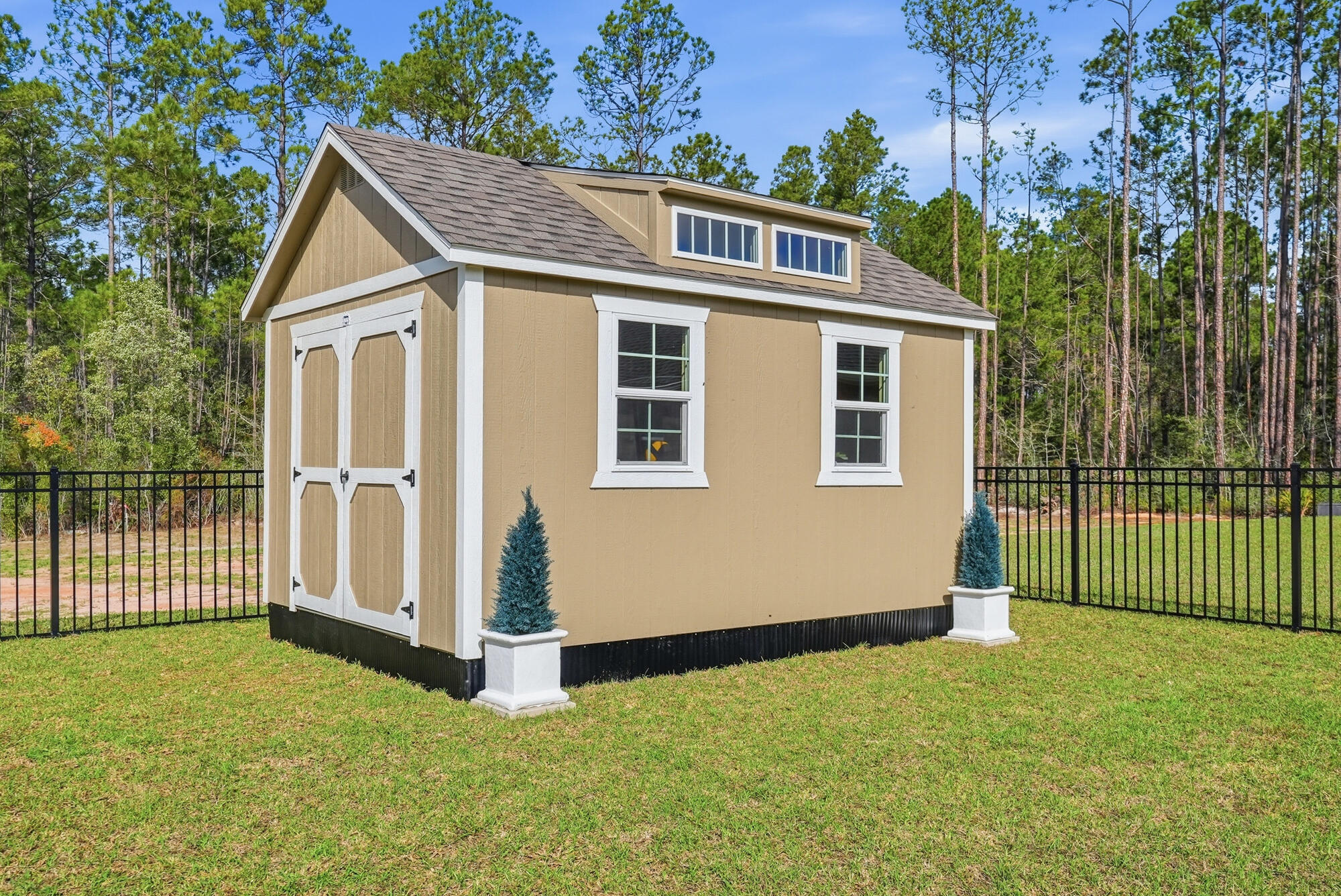 158 Bentgrass Road South Freeport, FL 32439 - Photo 41 of 66 a front view of a house with a garden