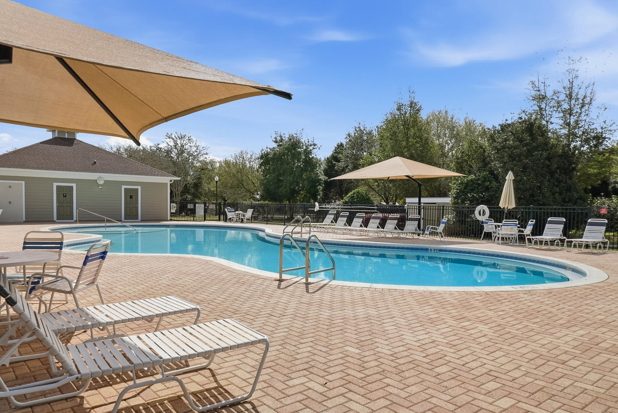 158 Bentgrass Road South Freeport, FL 32439 - Photo 53 of 66 a view of pool with table and chairs under an umbrella