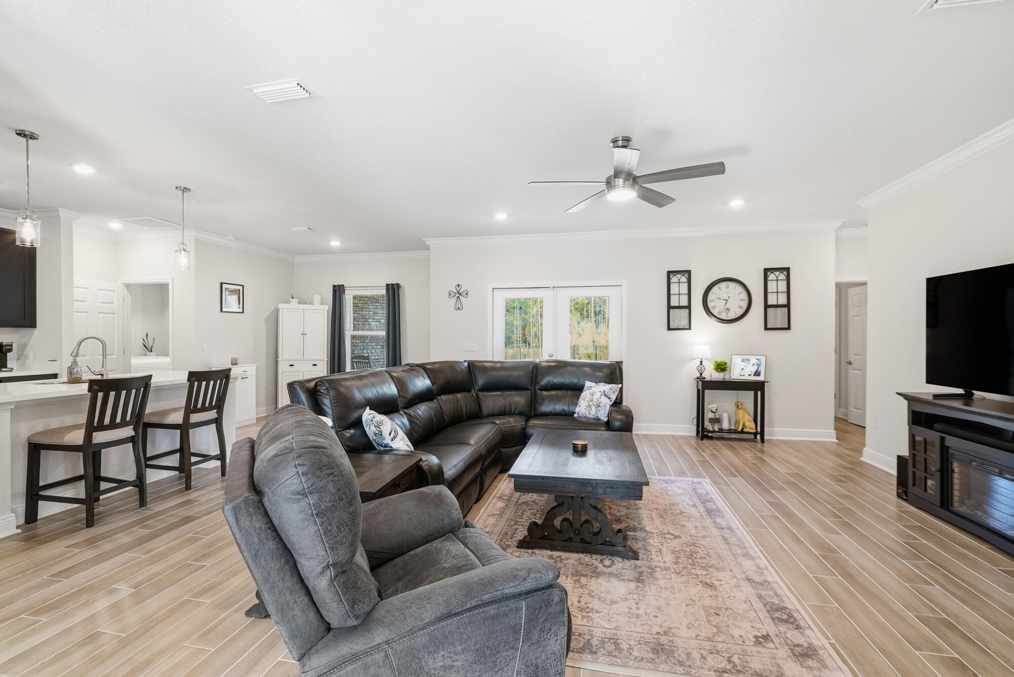 158 Bentgrass Road South Freeport, FL 32439 - Photo 7 of 66 a living room with furniture a fireplace and a flat screen tv