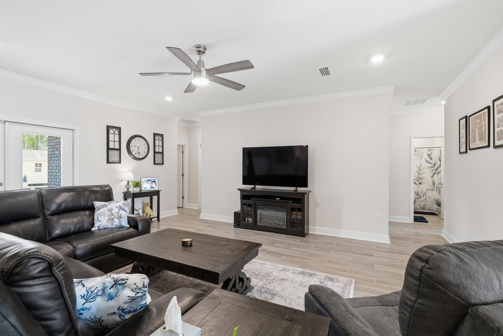 158 Bentgrass Road South Freeport, FL 32439 - Photo 9 of 66 a living room with furniture and a flat screen tv with wooden floor
