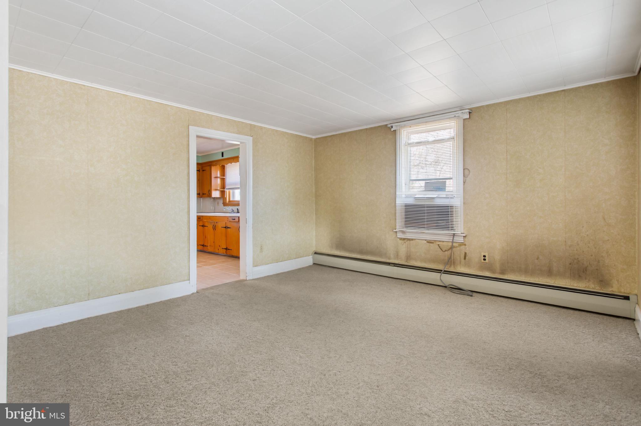 235 Ridge Avenue McSherrystown, PA 17344 - Photo 6 of 26 an empty room with a empty space and a window