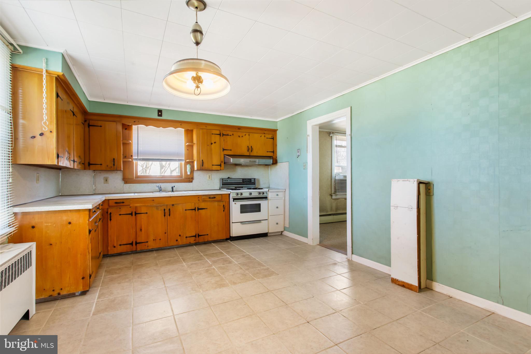 235 Ridge Avenue McSherrystown, PA 17344 - Photo 10 of 26 a large kitchen with a stove a sink dishwasher and a refrigerator