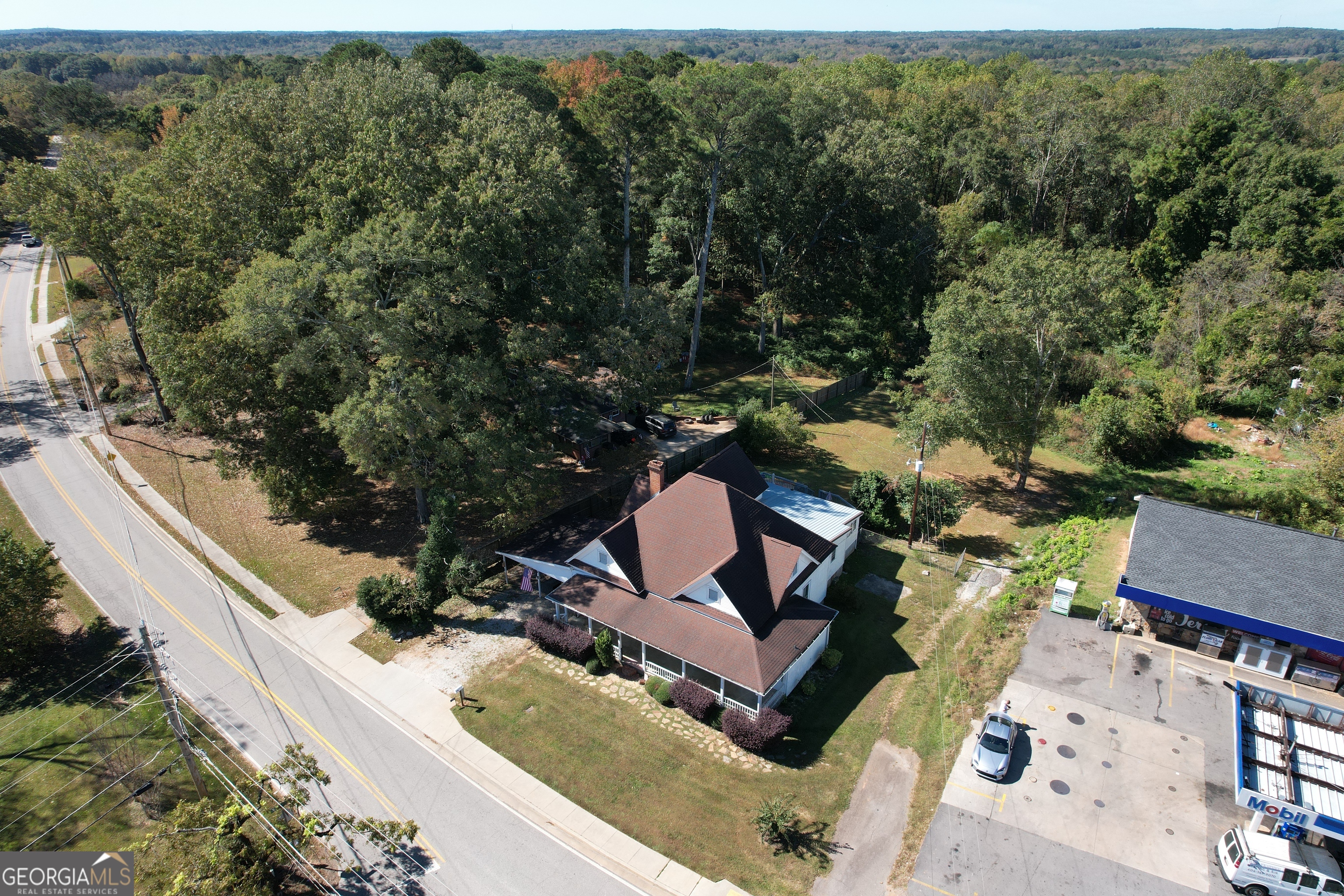1 Lower Jersey Road Covington, GA 30014 - Photo 6 of 7 an aerial view of a house with a yard and lake view