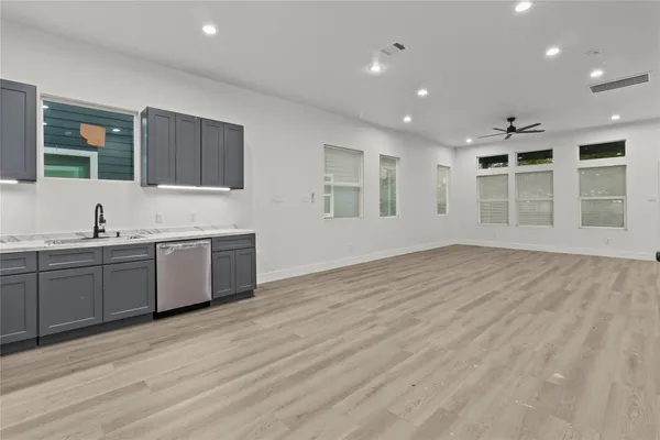 a view of a kitchen with a sink cabinets and a window