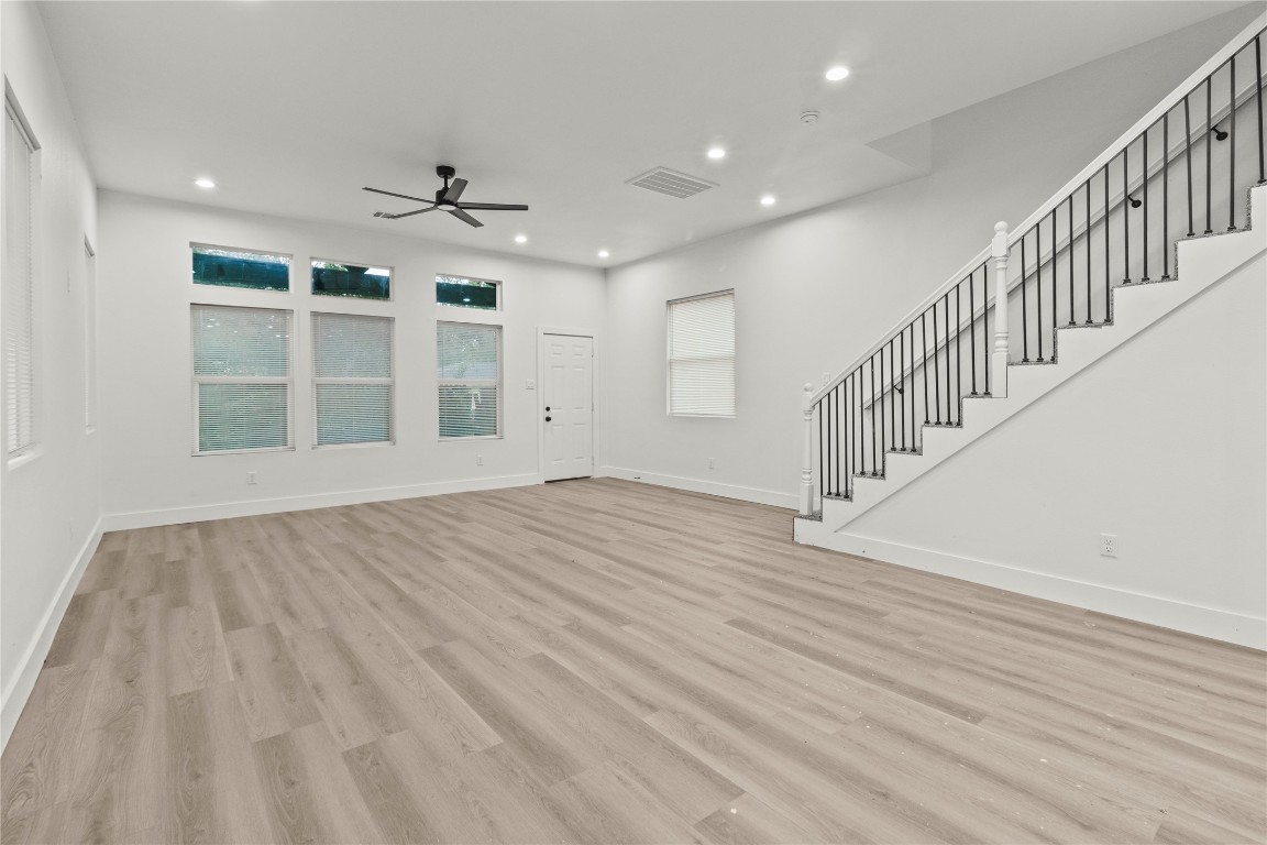 8129 Hoffman Street Houston, TX 77016 - Photo 7 of 18 wooden floor in an empty room with a window