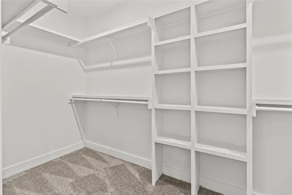 a view of an empty walk in closet