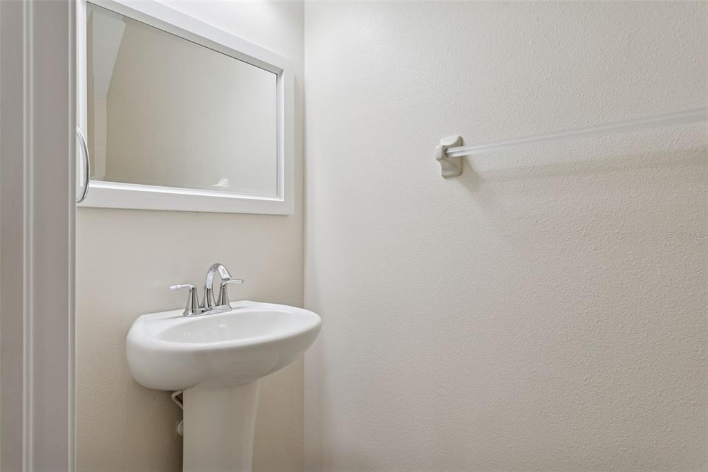 9568 Trumpet Vine Loop Trinity, FL 34655 - Photo 12 of 25 a bathroom with a sink and mirror