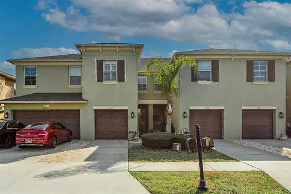 a front view of a house with a garage