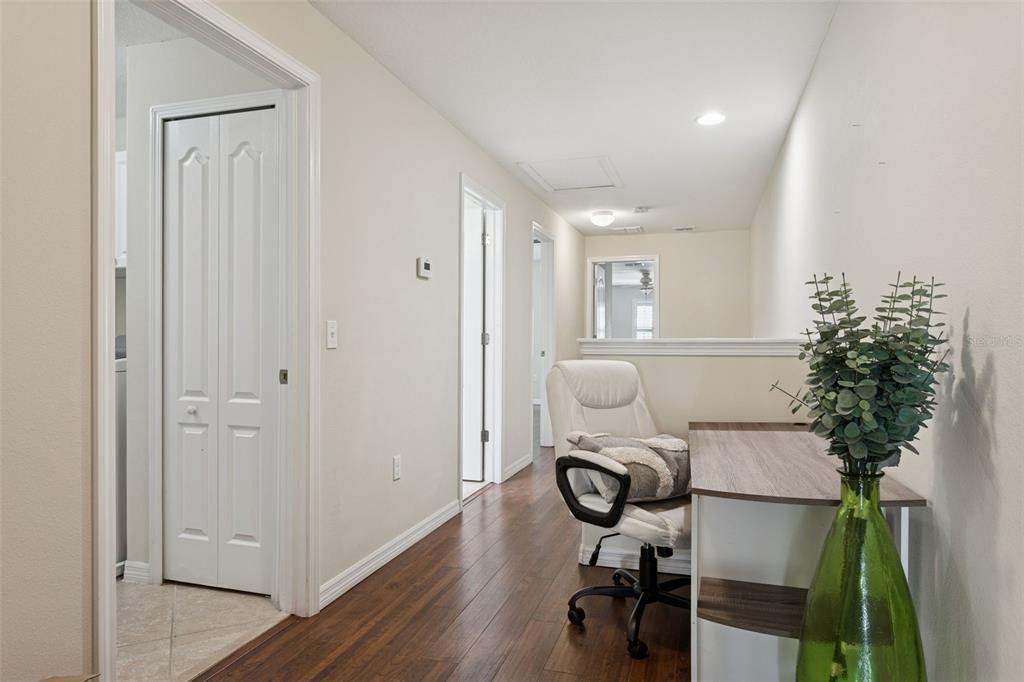 9568 Trumpet Vine Loop Trinity, FL 34655 - Photo 21 of 25 a view of workspace with wooden floor and bathroom view