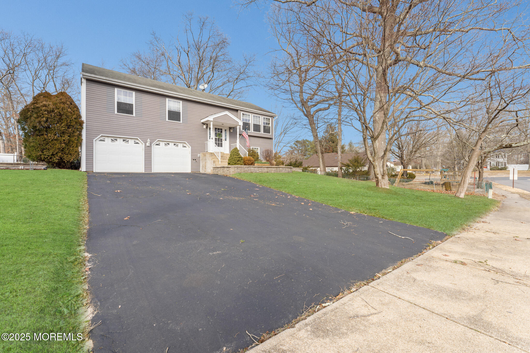 4 Yorkshire Drive Jackson, NJ 08527 - Photo 1 of 58 a front view of a house with a yard and garage