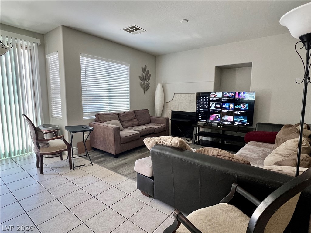 151 Short Ruff Way Las Vegas, NV 89148 - Photo 12 of 17 Tiled floors and generous windows enhance this inviting living space.