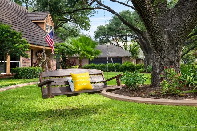 a view of a house with backyard and a slide