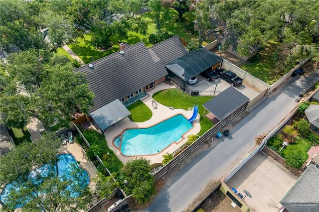 an aerial view of a house with outdoor space