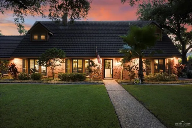 a couple of table and chairs under the roof