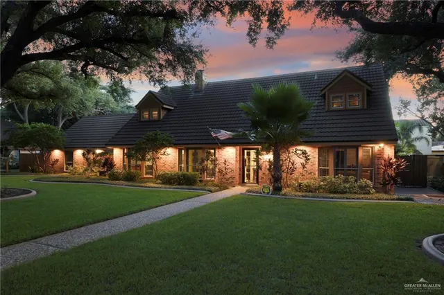 a view of a big yard next to a house