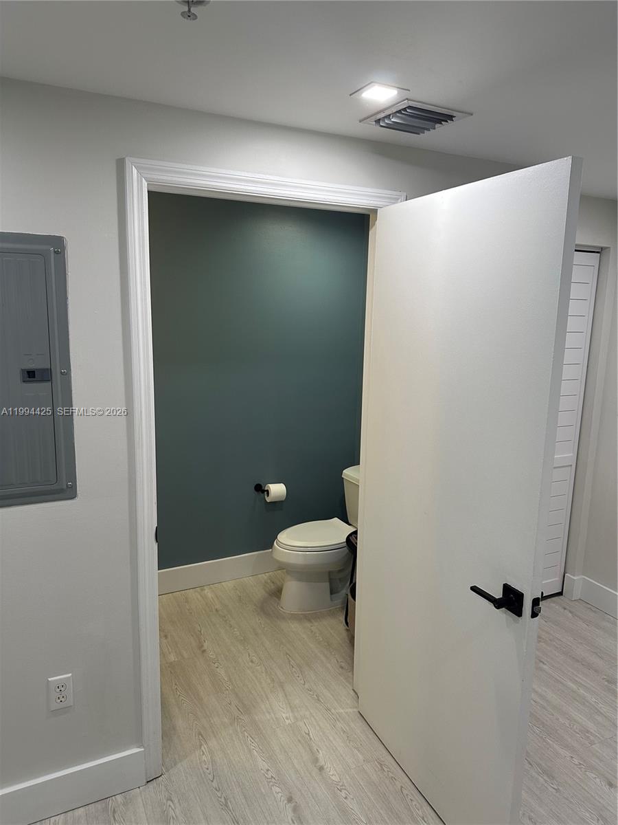 3339 Virginia Street, Unit 127 Miami, FL 33133 - Photo 11 of 25 a bathroom with a toilet and a shower