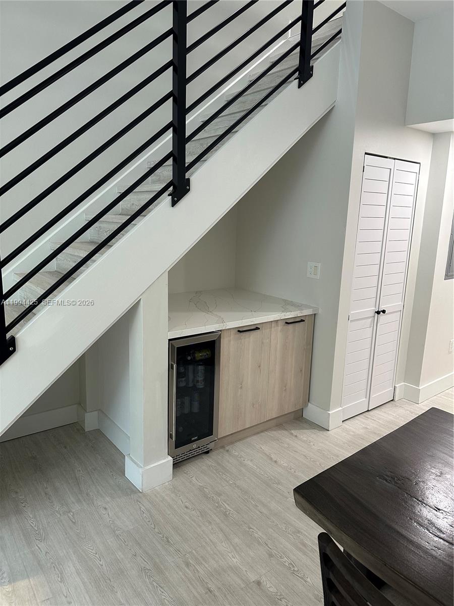 3339 Virginia Street, Unit 127 Miami, FL 33133 - Photo 5 of 25 a view of an empty room with wooden floor