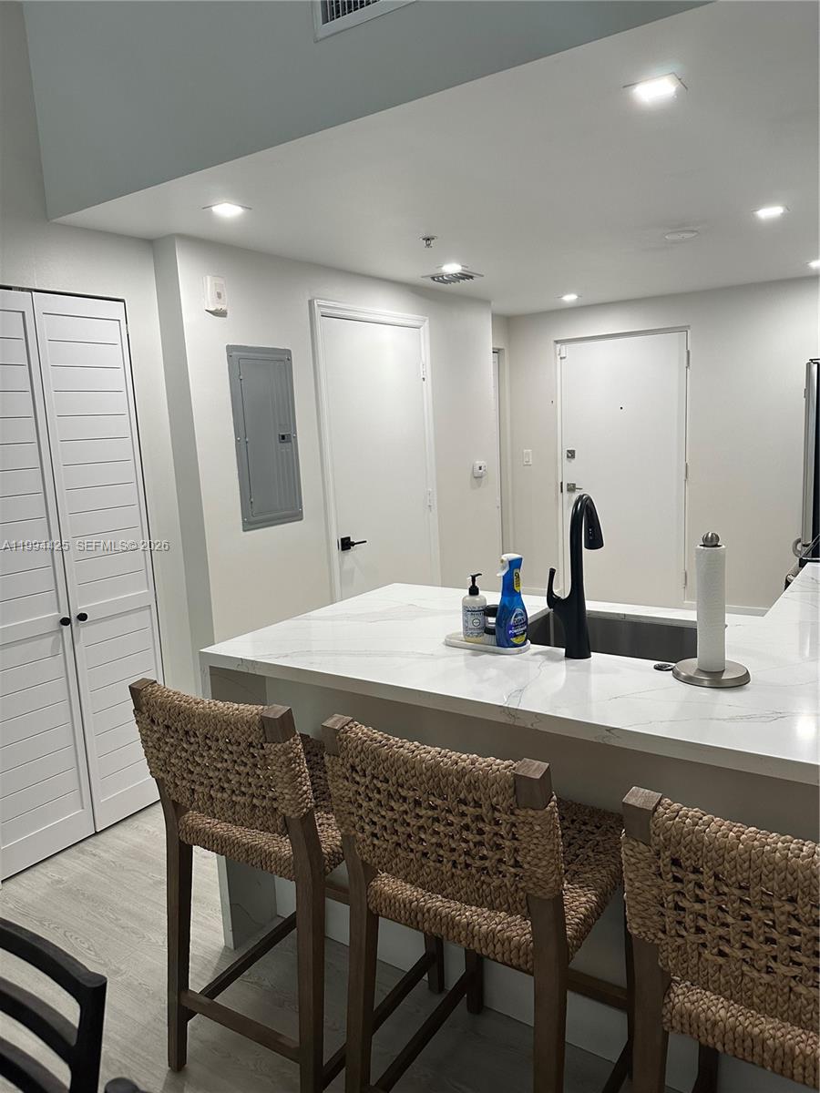 3339 Virginia Street, Unit 127 Miami, FL 33133 - Photo 6 of 25 a dining table with chairs and view kitchen