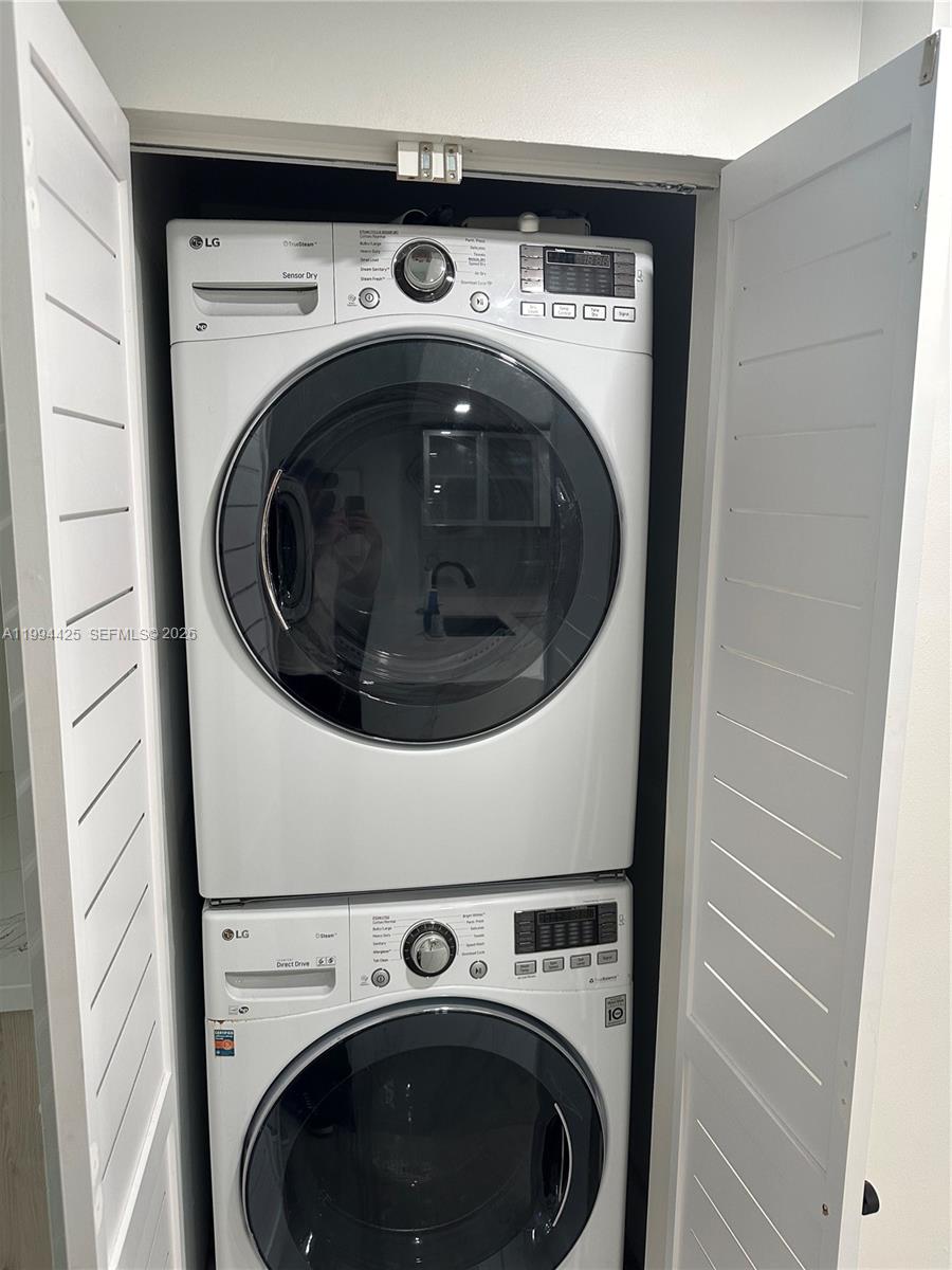 3339 Virginia Street, Unit 127 Miami, FL 33133 - Photo 8 of 25 a utility room with dryer and washer
