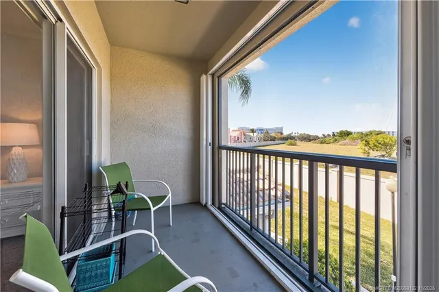 a view of a balcony with furniture