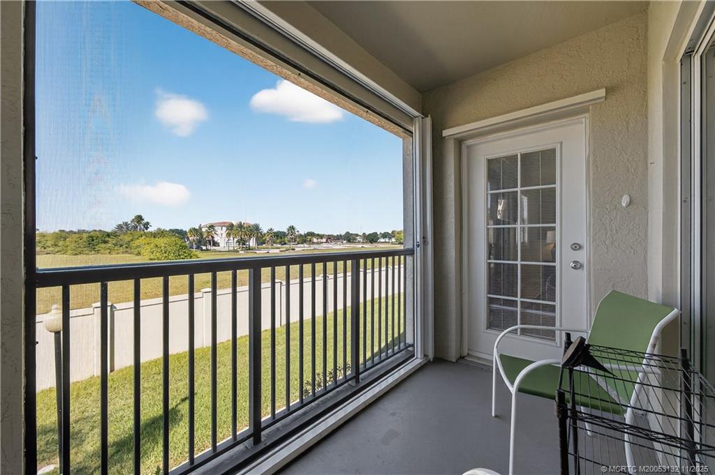 160 Southwest Peacock Boulevard, Unit 31203 Port St. Lucie, FL 34986 - Photo 26 of 43 a view of balcony with chair