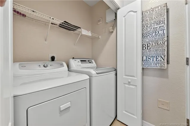 a utility room with dryer and washer