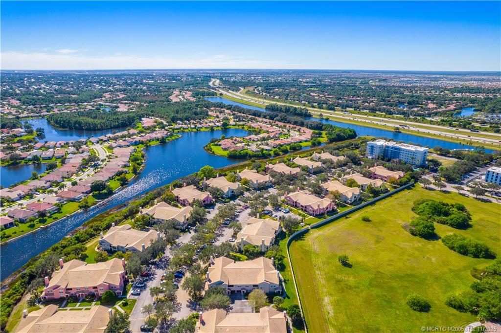 160 Southwest Peacock Boulevard, Unit 31203 Port St. Lucie, FL 34986 - Photo 36 of 43 a view of a city with an ocean