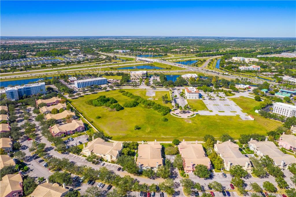 160 Southwest Peacock Boulevard, Unit 31203 Port St. Lucie, FL 34986 - Photo 38 of 43 a view of a city with an ocean