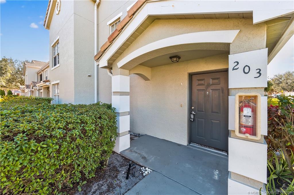 160 Southwest Peacock Boulevard, Unit 31203 Port St. Lucie, FL 34986 - Photo 43 of 43 a view of front door of house