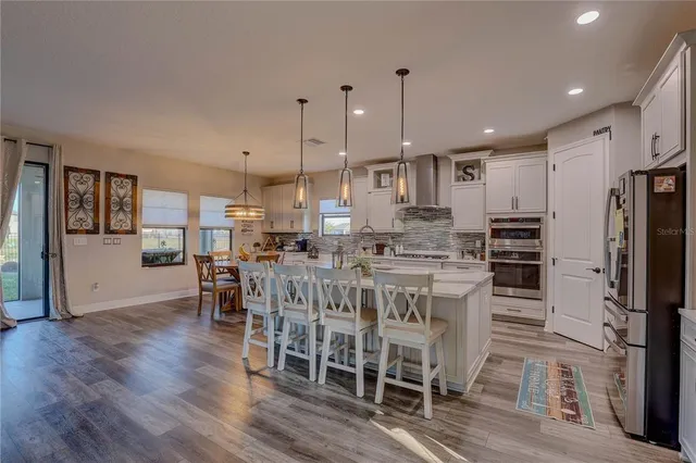 a kitchen with a sink stove and refrigerator