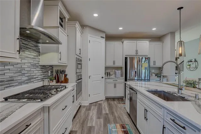 a dining room with furniture and wooden floor