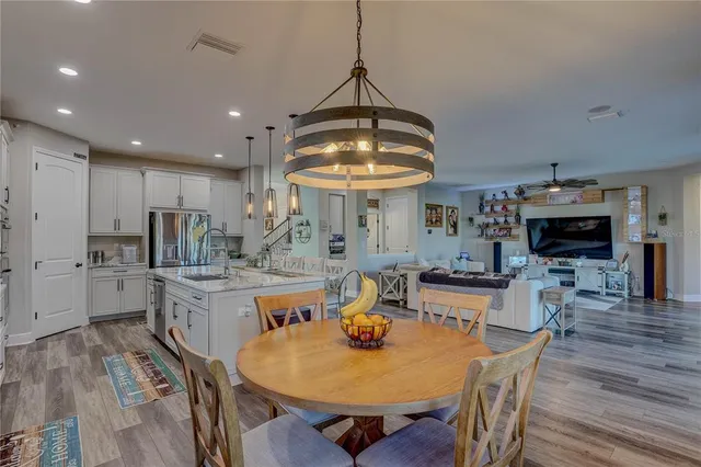 a bedroom with a large bed dresser and a window