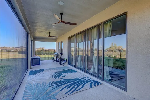 a spacious bathroom with double vanity a toilet a shower a sink and mirror