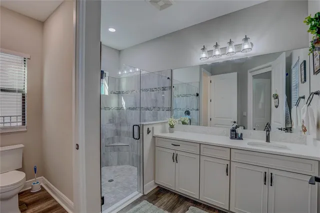 a bedroom with furniture and a ceiling fan