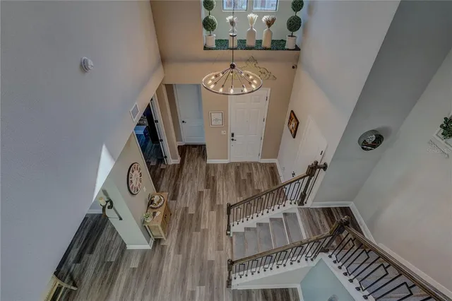 a view of a livingroom with furniture window and wooden floor