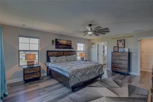 a bathroom with a double vanity sink a mirror and a shower