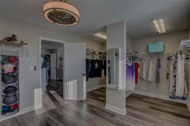 a bathroom with a sink a toilet a mirror and shower