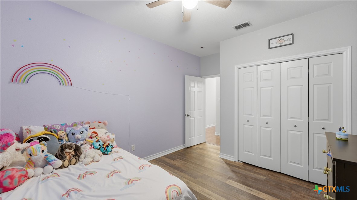 2216 Hornsby Spring Branch, TX 78070 - Photo 18 of 33 a bedroom with a bed and a dresser